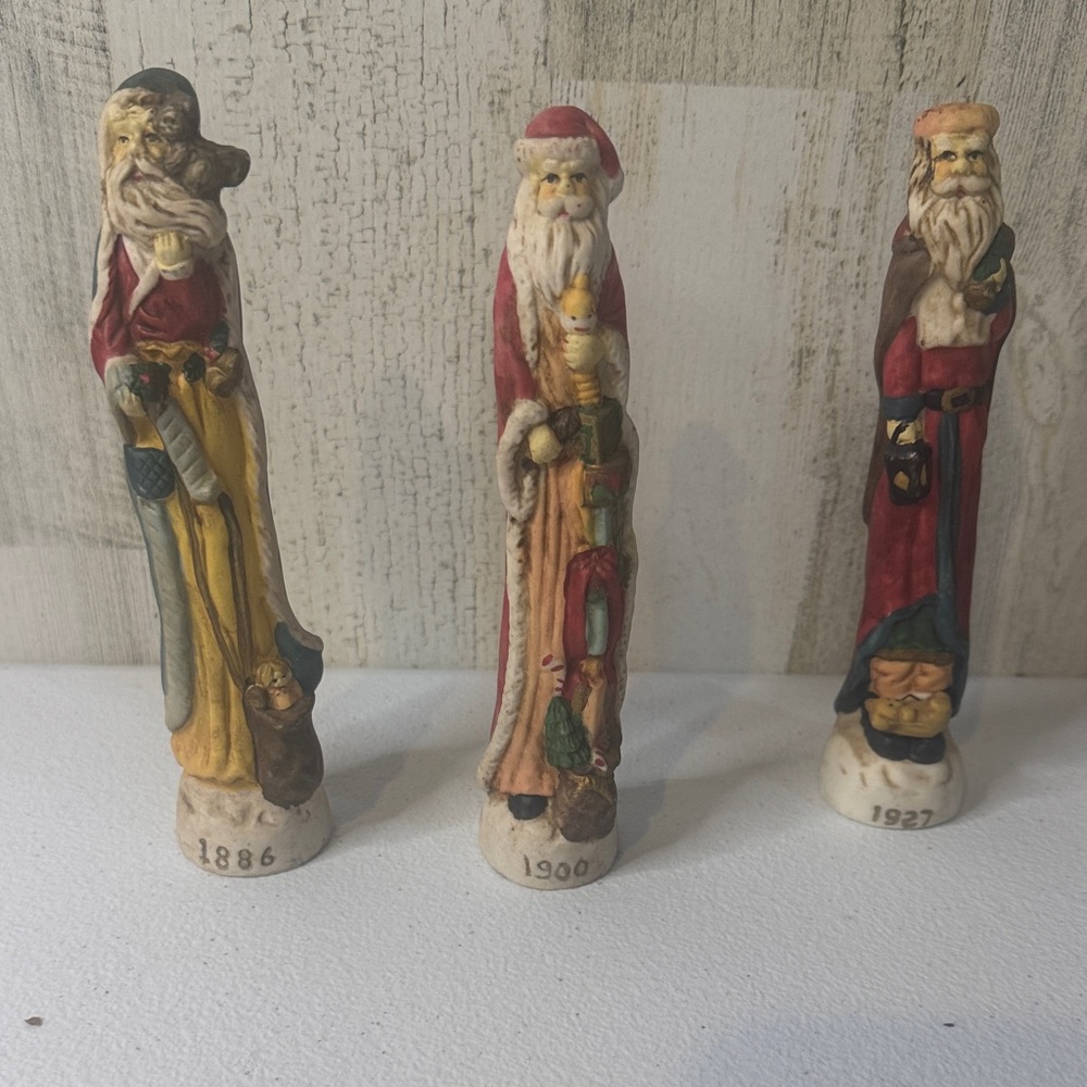 Charming Santa Claus Figurine Trio - Red, Yellow, Brown